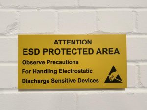 Yellow warning sign which says ESD PROTECTION AREA