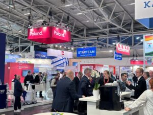 People milling around, chatting, at the Starteam stall at the Electronica exhibition in 2024