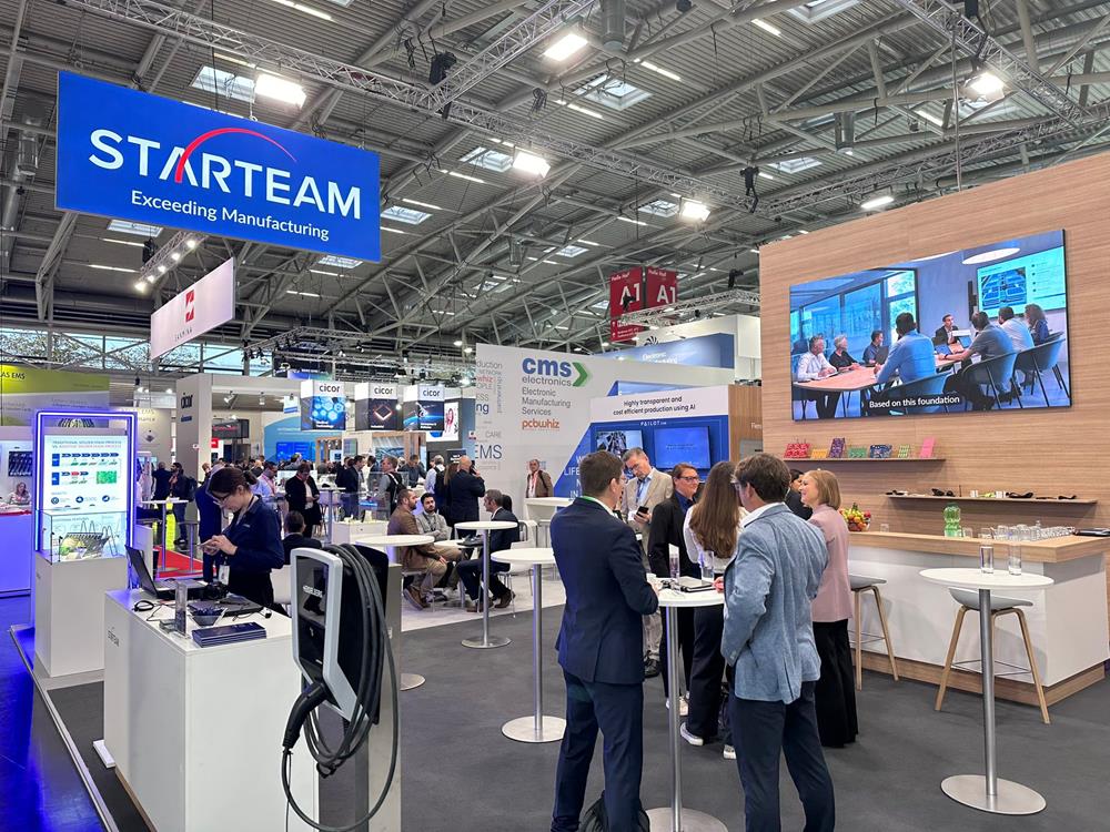People milling around, chatting, at the Starteam stall at the Electronica exhibition in 2024