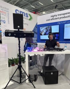 DJ Groove playing at an exhibition stand at Electronica 2024